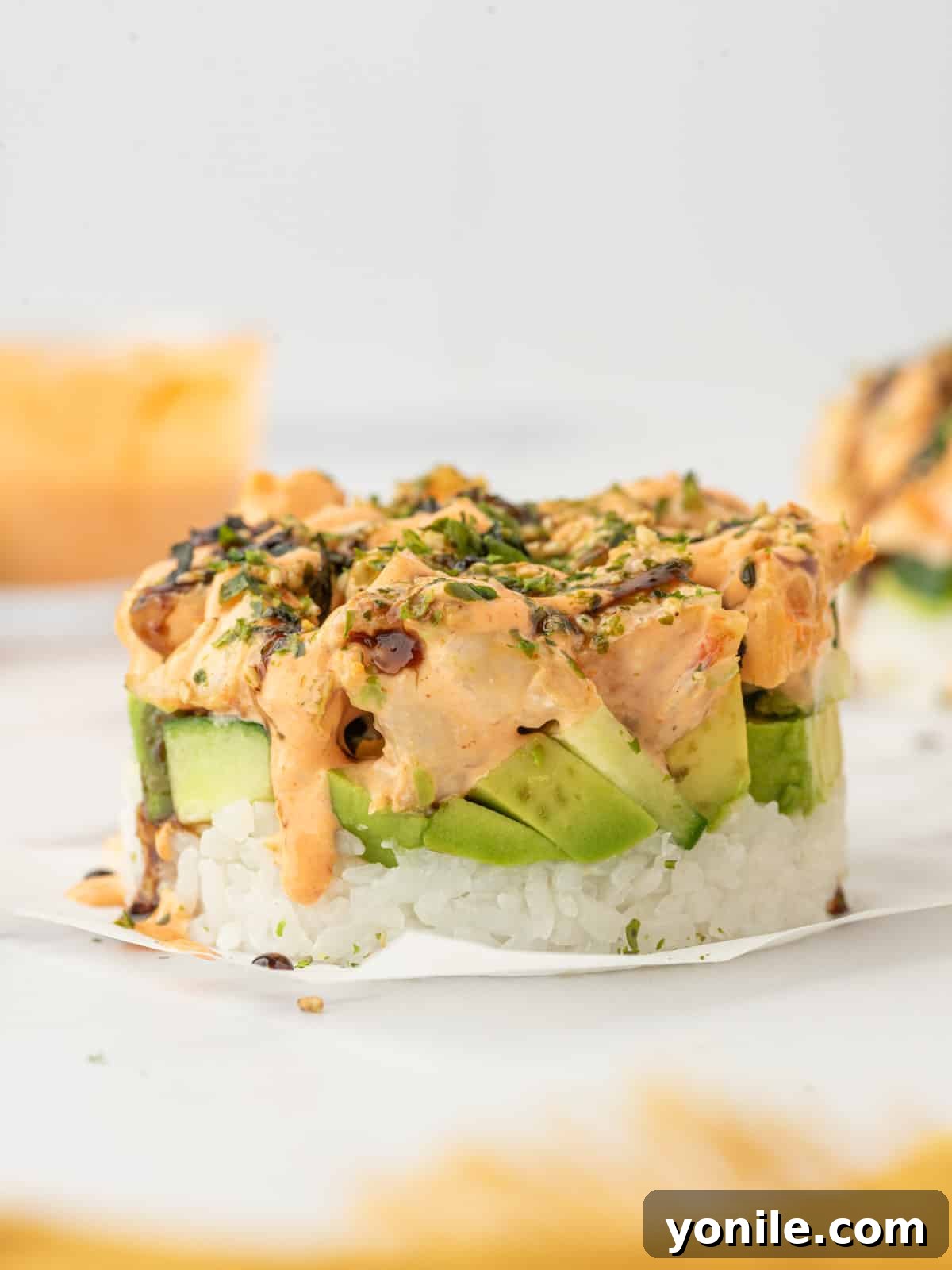Shrimp Sushi Tower 9 A deconstructed California roll with shrimp, beautifully stacked on a plate.