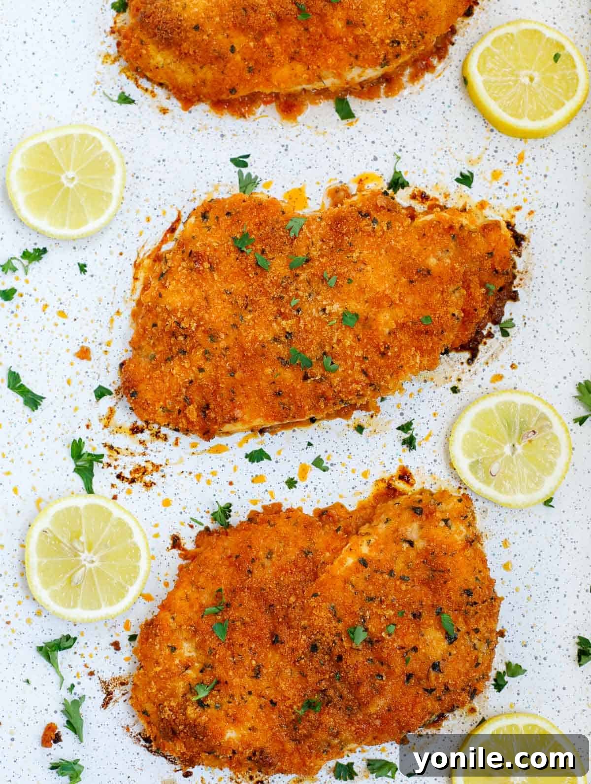 Perfectly baked, crispy chicken cutlets waiting to be served.