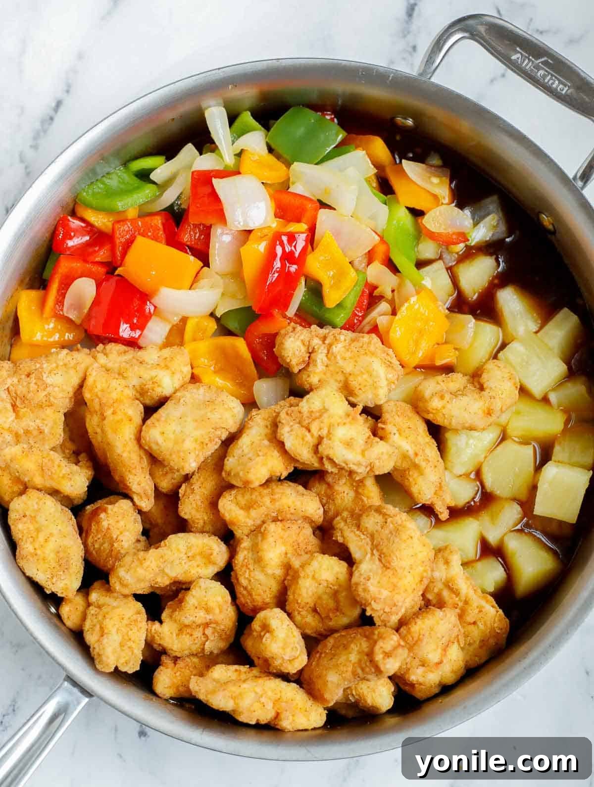Combining ingredients for Chinese sweet and sour chicken recipe.
