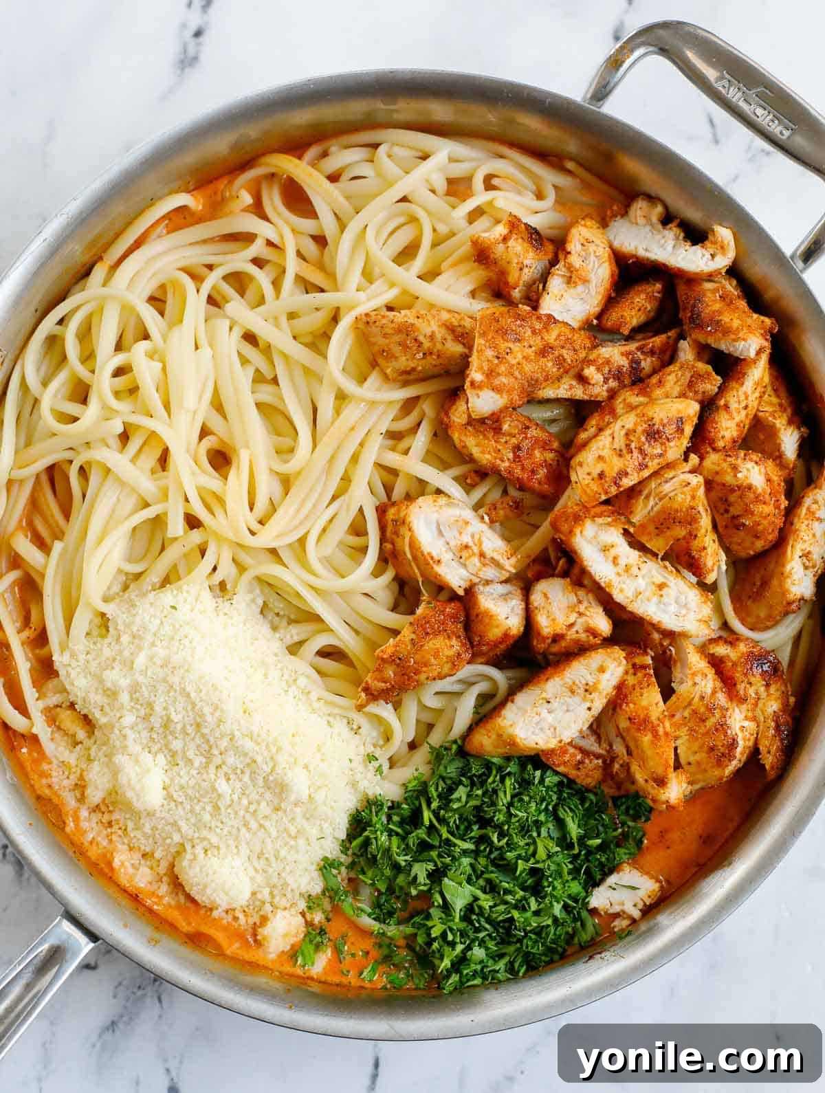 Combine pasta and chicken with spicy pasta sauce in a large skillet for a harmonious blend of flavors.
