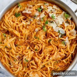 A skillet of chicken and spicy pasta sauce.