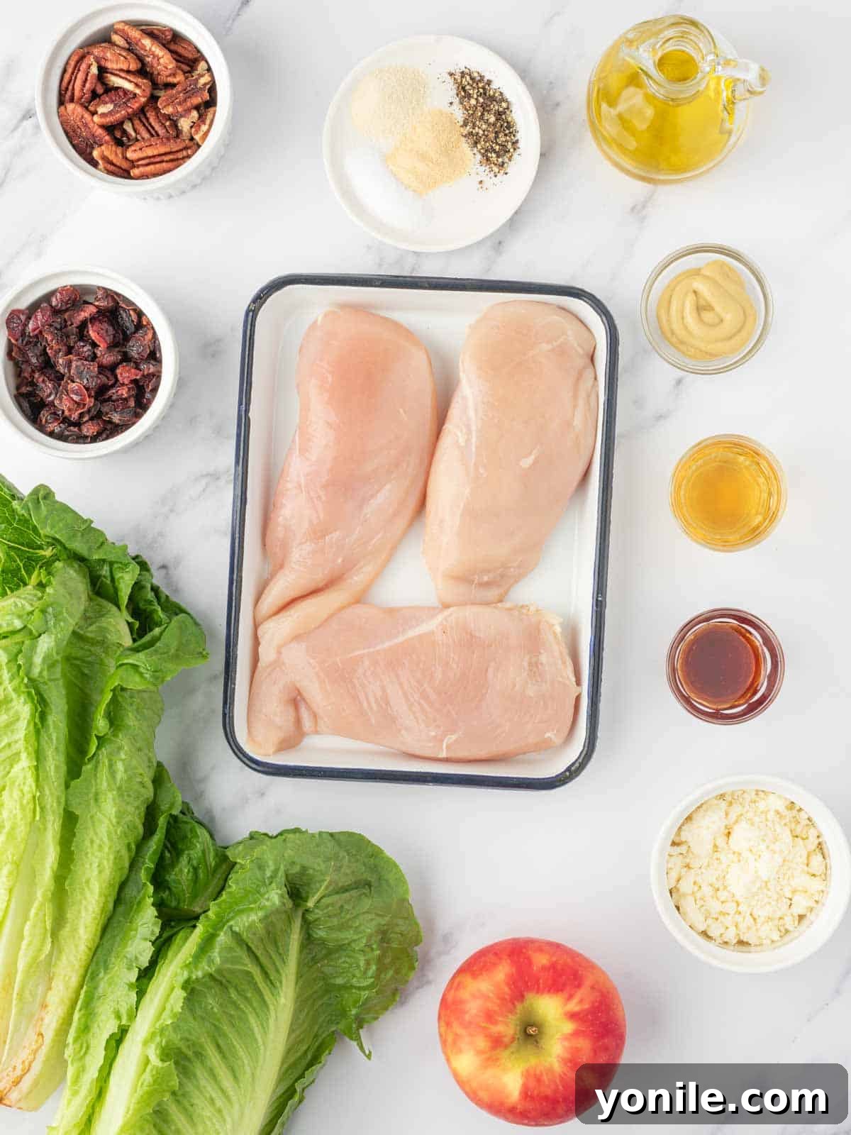 Autumn Harvest Chopped Chicken Salad 3 Ingredients needed for healthy autumn chicken salad laid out on a wooden board.