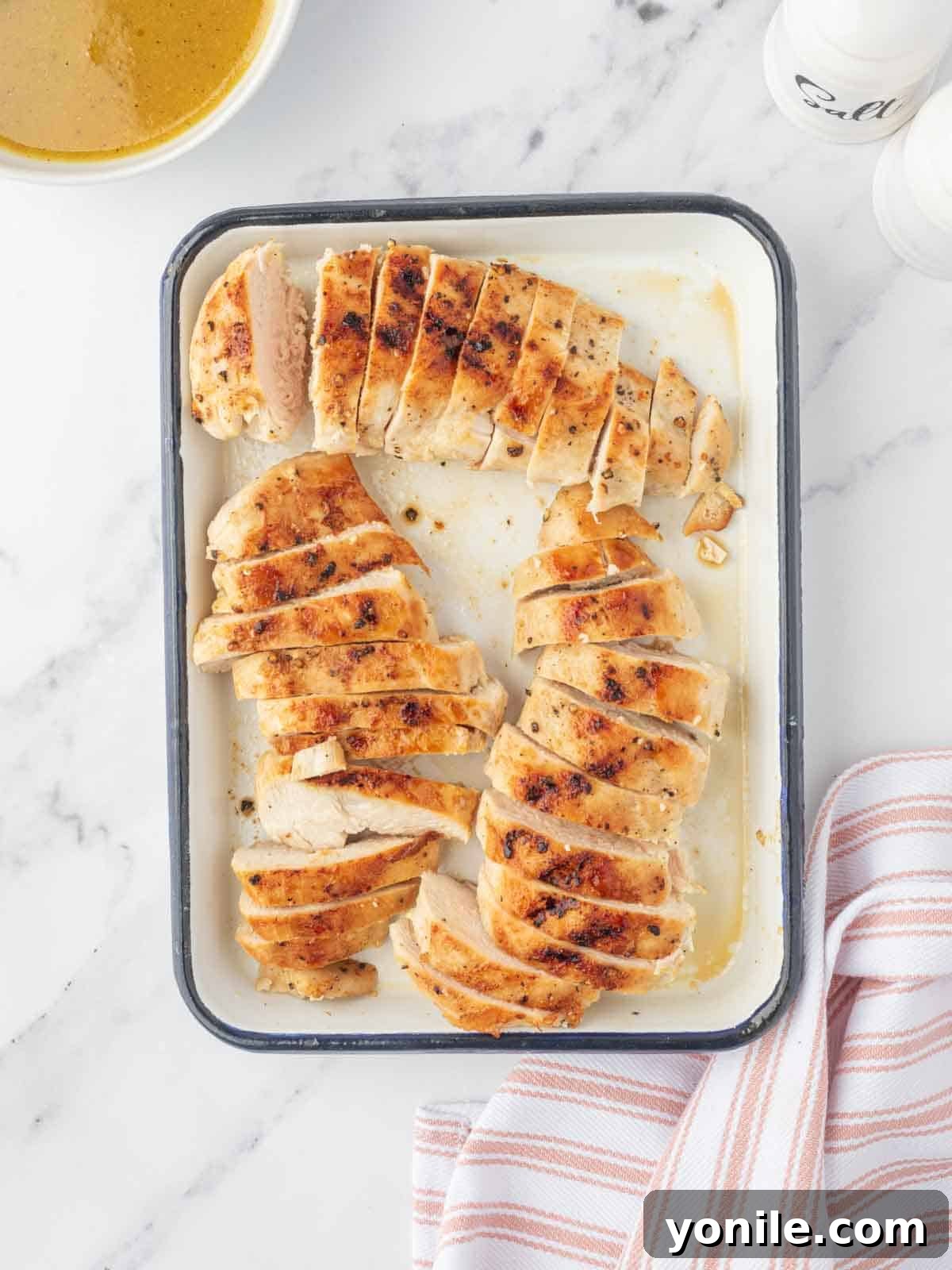 Autumn Harvest Chopped Chicken Salad 5 Grilled chicken breasts sliced and arranged on a platter.