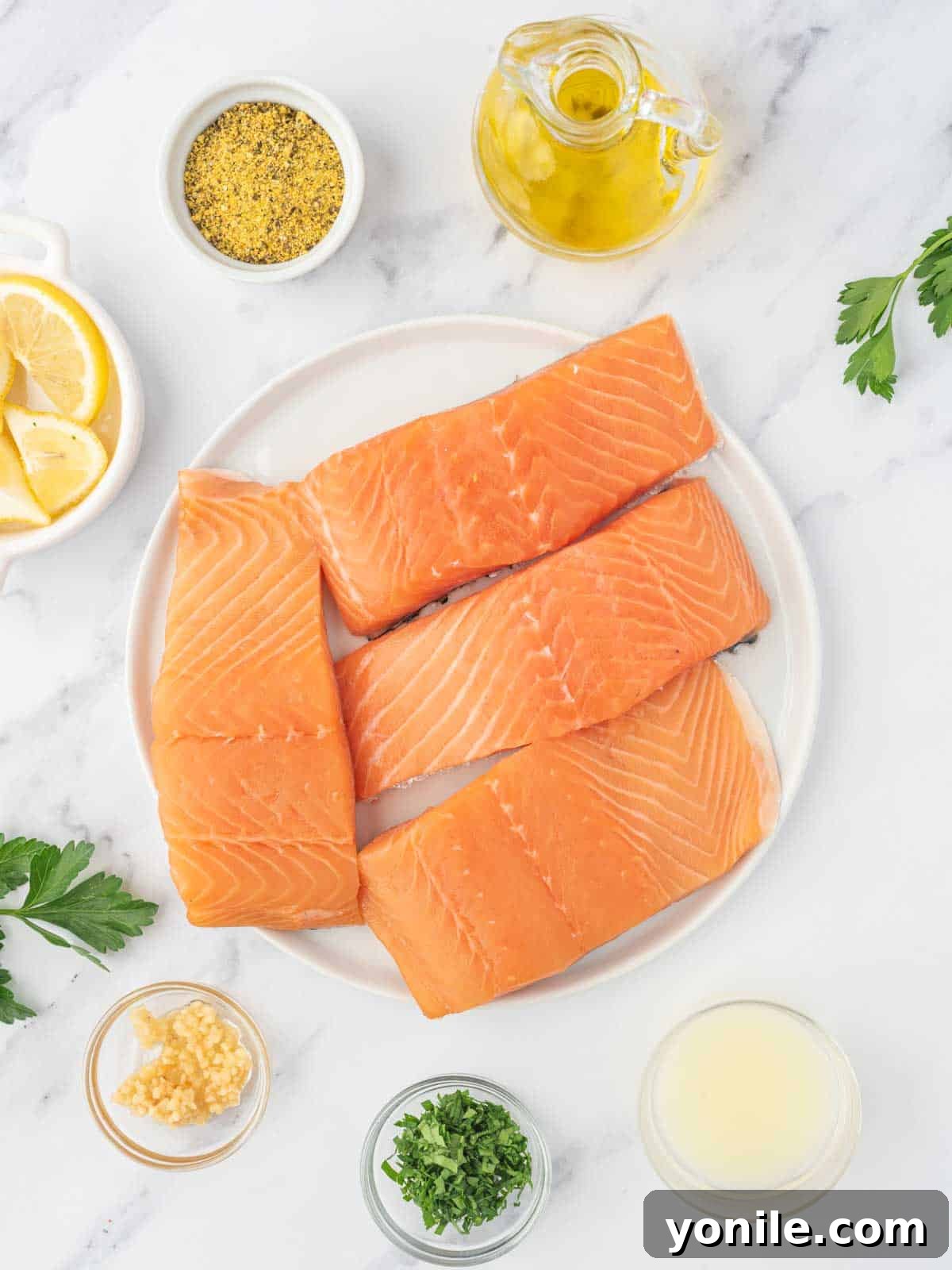 Ingredients needed for baked lemon pepper salmon.