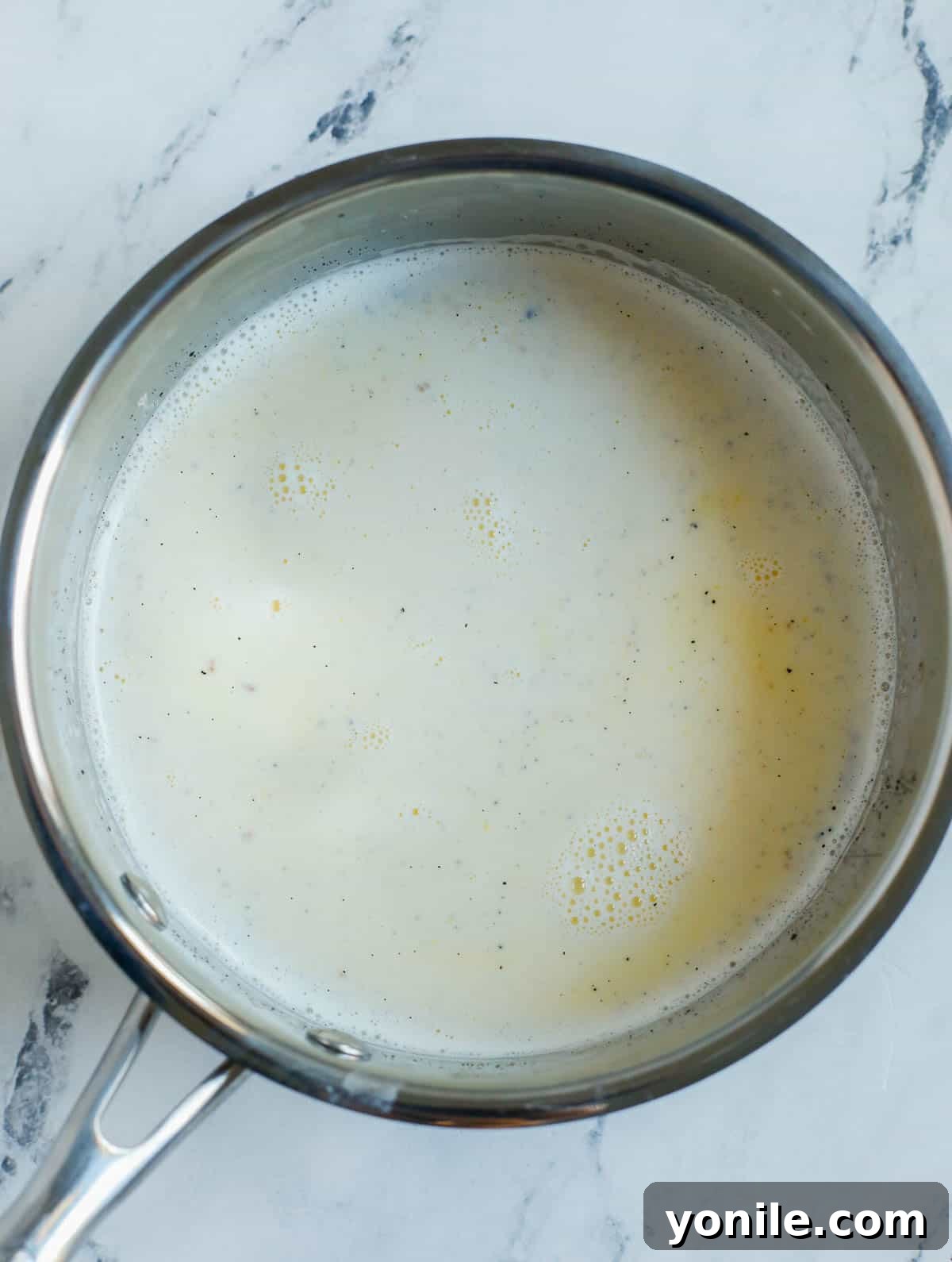 milk and creme mixture in a pot.