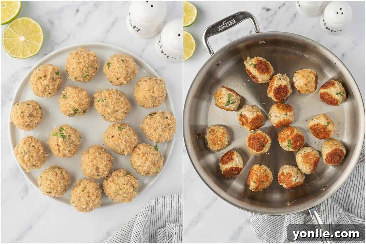 Hands forming ground chicken mixture into balls and then browning them in a hot skillet with oil.