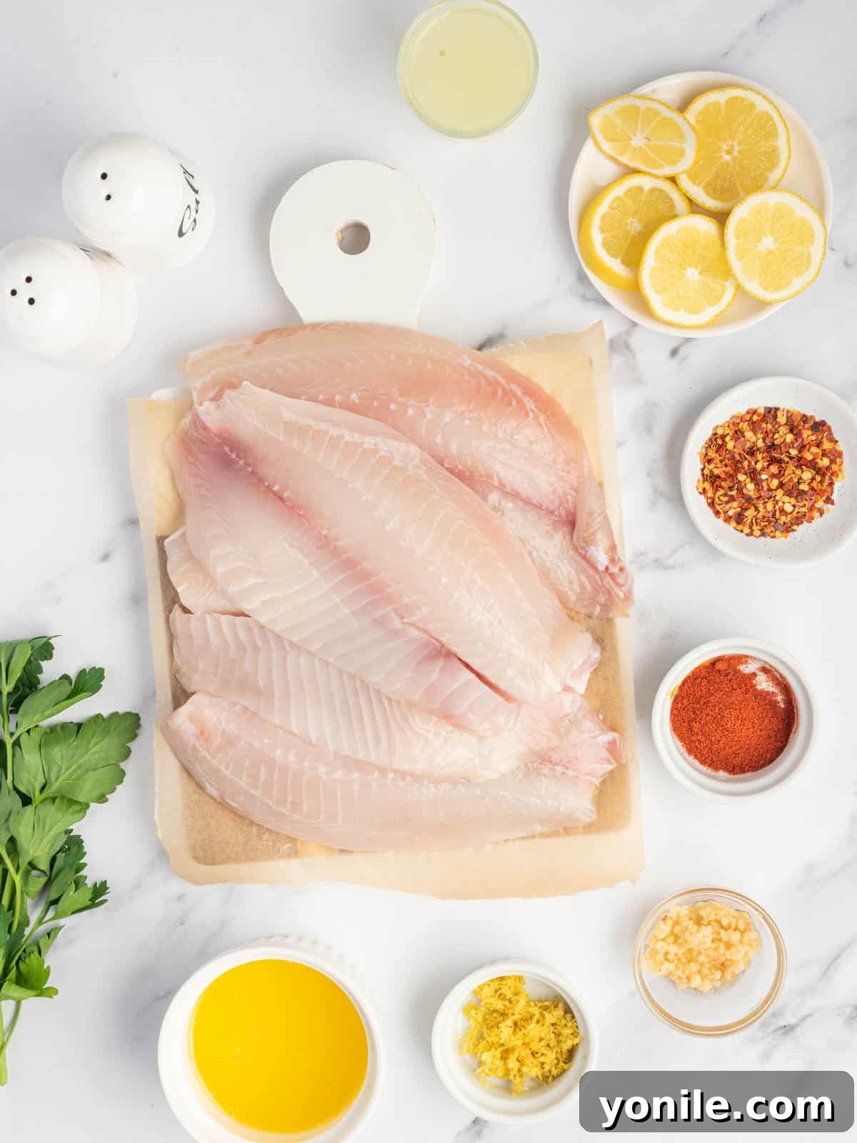Ingredients needed for garlic butter oven baked tilapia.