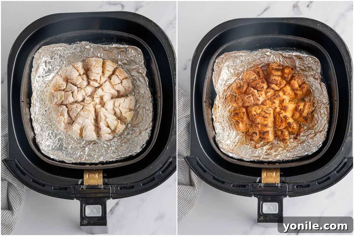 Golden Air Fryer Onion Bloom 6 Blooming onion cooking inside an air fryer basket, achieving a golden crisp.
