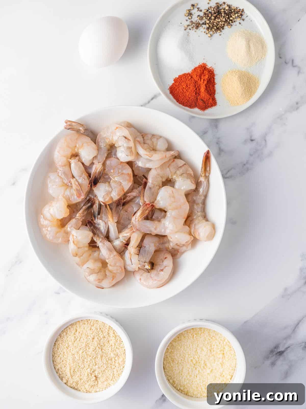 Crispy Air Fryer Keto Shrimp 3 Ingredients needed for air fryer keto shrimp spread out on a counter.