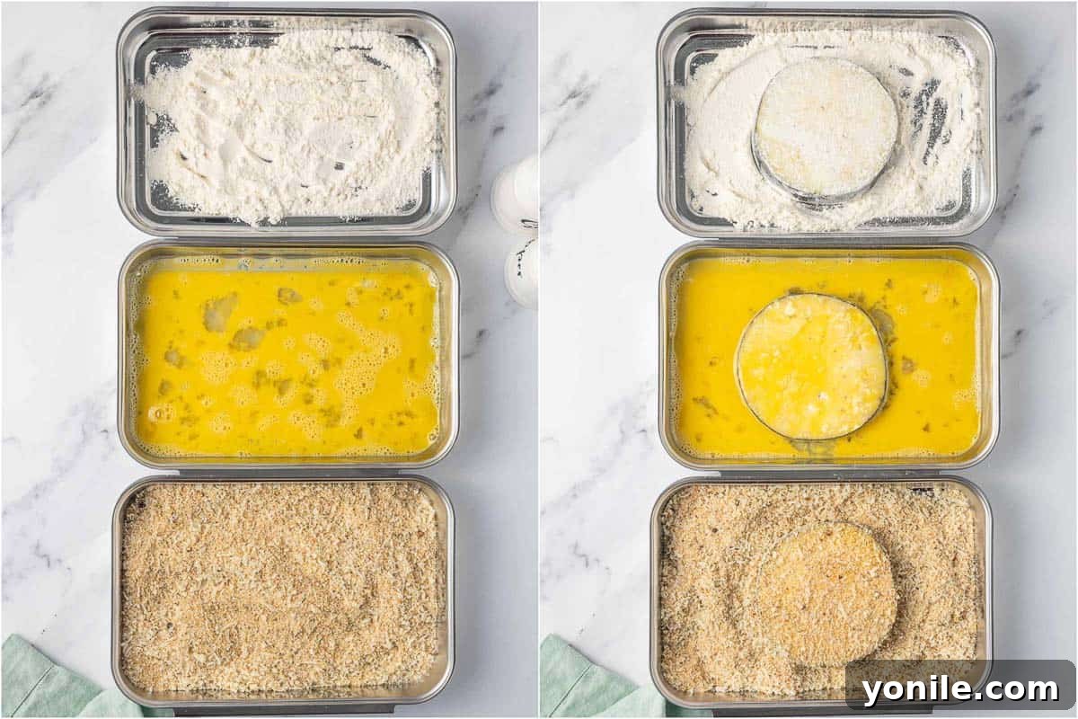 Golden Crispy Air-Fried Eggplant 5 Three dredging stations prepared with flour, whisked eggs, and seasoned breadcrumbs for coating eggplant.