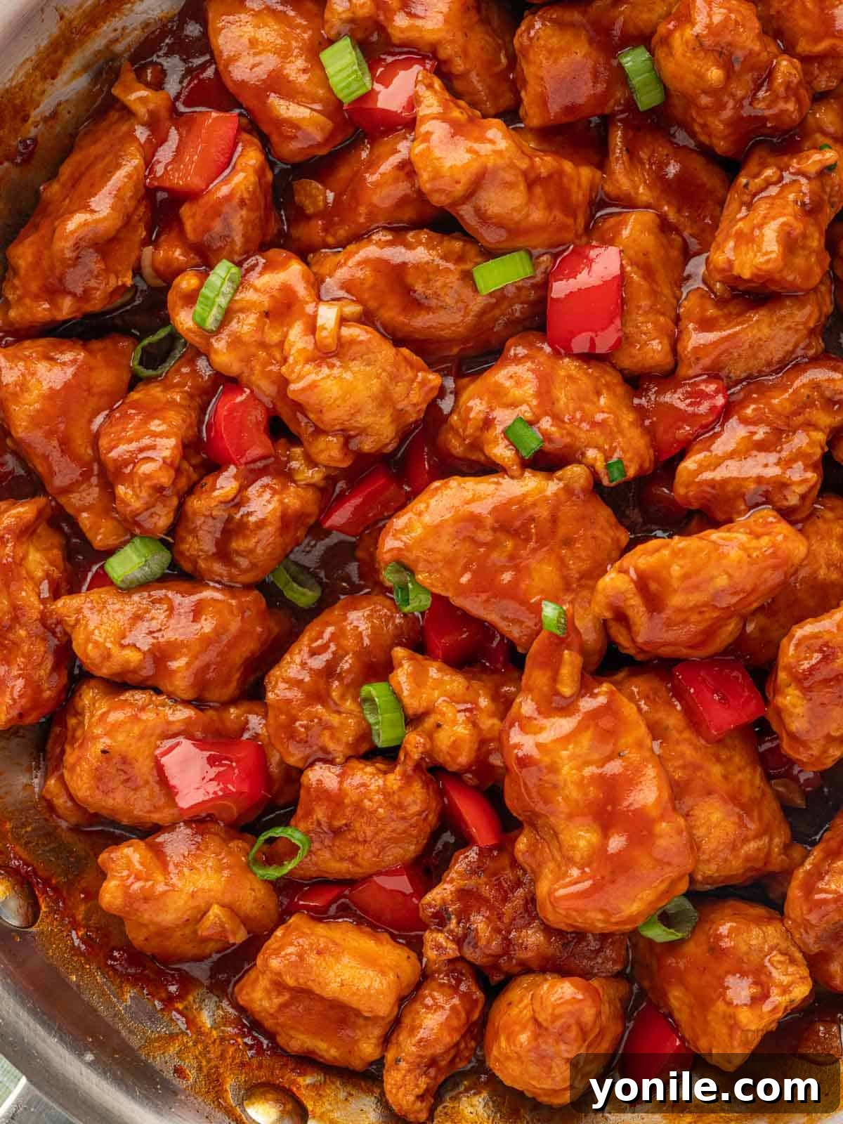 Indo-Chinese Chicken Sensation 8 Close up of Indian chicken recipe, highlighting the glossy sauce and chicken texture.