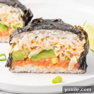 Close-up view of a sushi burger crafted with a Japanese seaweed wrap, displaying the layers within.
