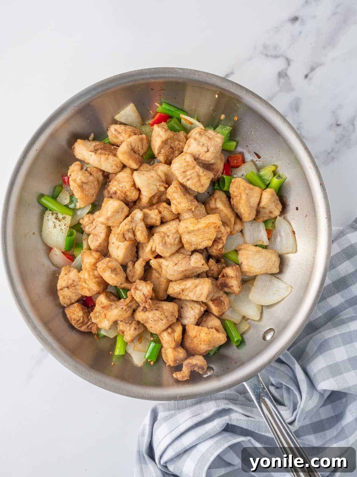 Golden Salt and Pepper Chicken 7 crispy salt and pepper chicken in a wok.