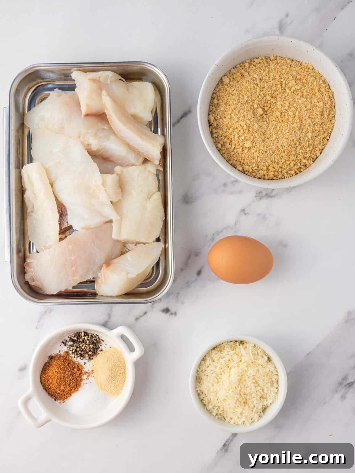 Crispy Gluten Free Fish and Chips 3 Ingredients needed for gluten free fish and chips, including cod, egg, panko, parmesan, and seasonings.