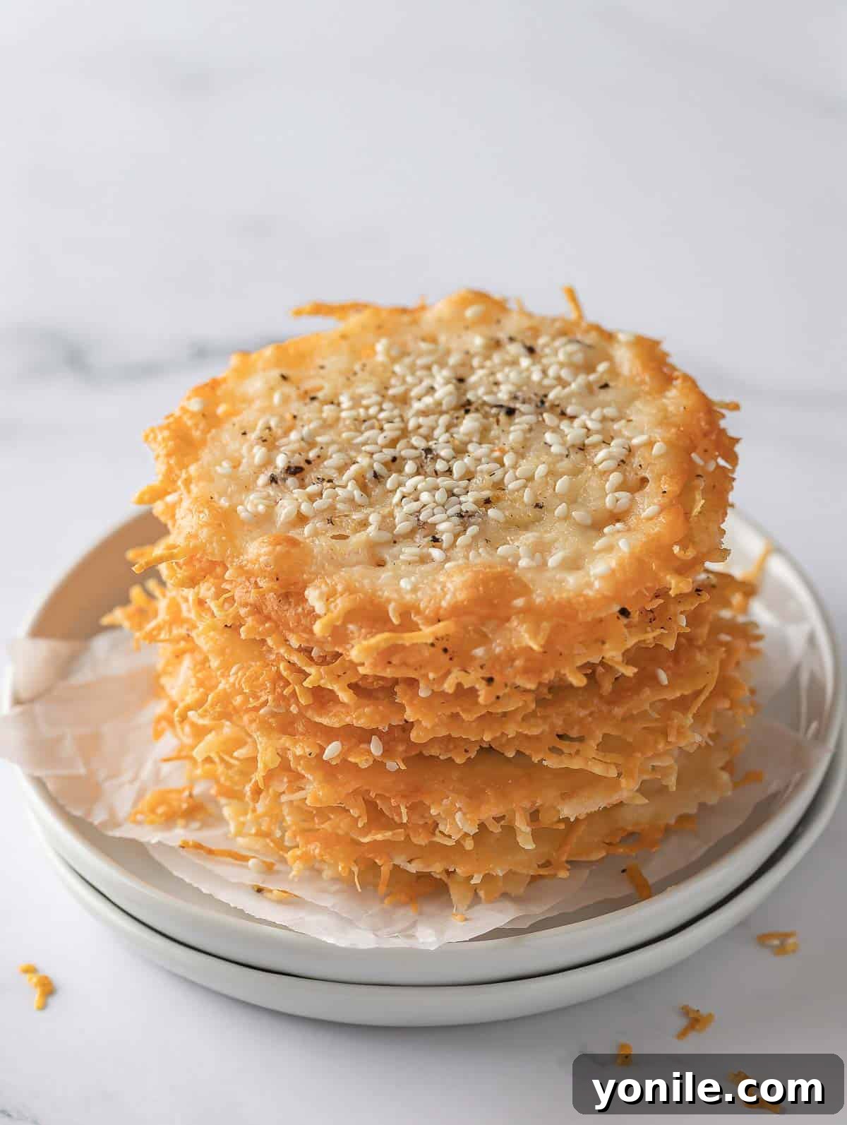 Crispy Parmesan Bites 2 A pile of homemade parmesan keto crisps, golden and perfectly crispy, ready for snacking.