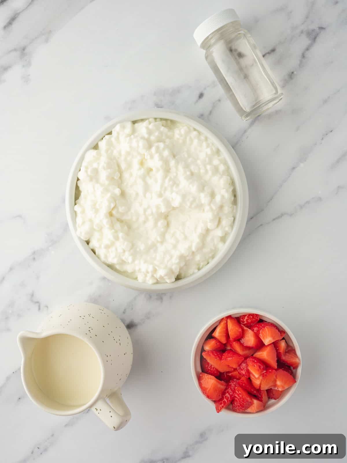 Ingredients needed for strawberry cottage cheese ice cream.