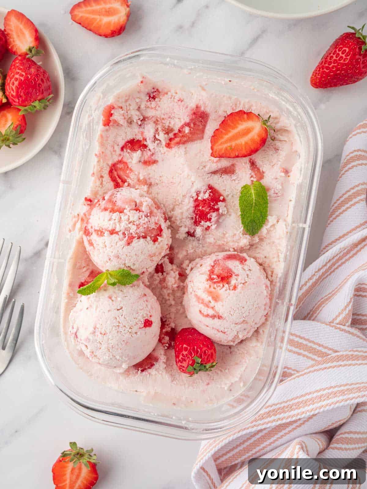 Strawberry ice cream in a container.