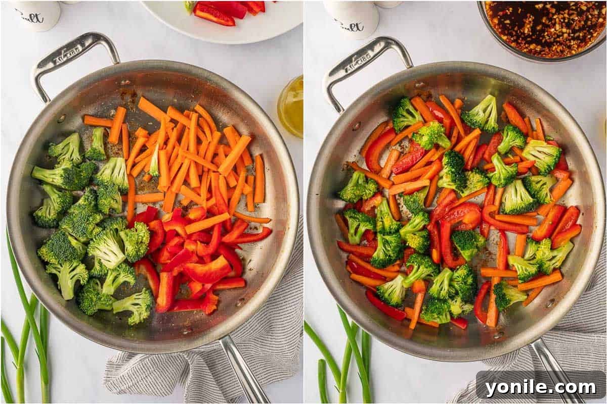 Fiery Hunan Chicken 5 Stir-fry vegetables including broccoli florets, red bell pepper, and carrots in a skillet.