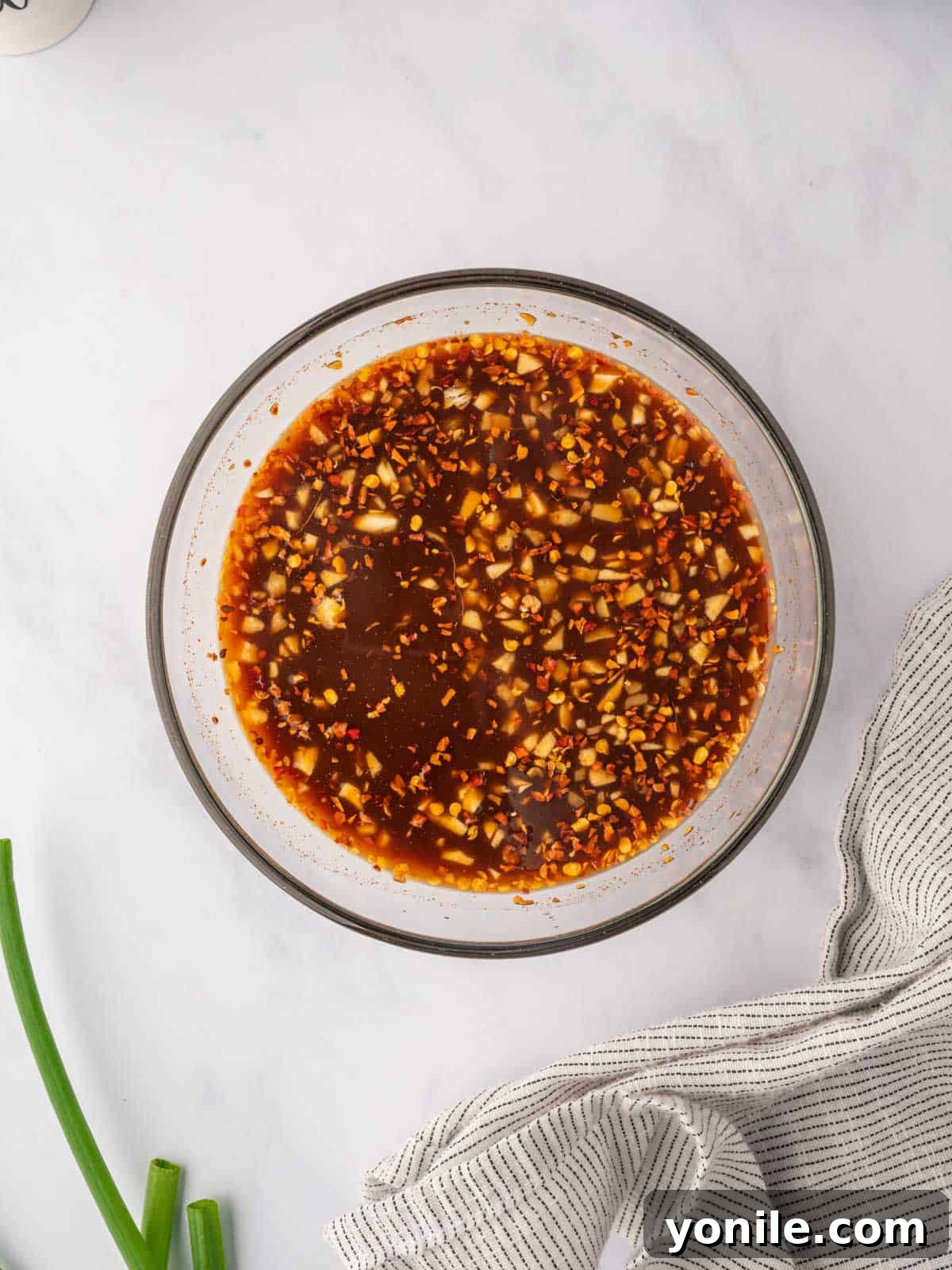 Fiery Hunan Chicken 6 Spicy Hunan chicken sauce ingredients mixed thoroughly in a bowl.