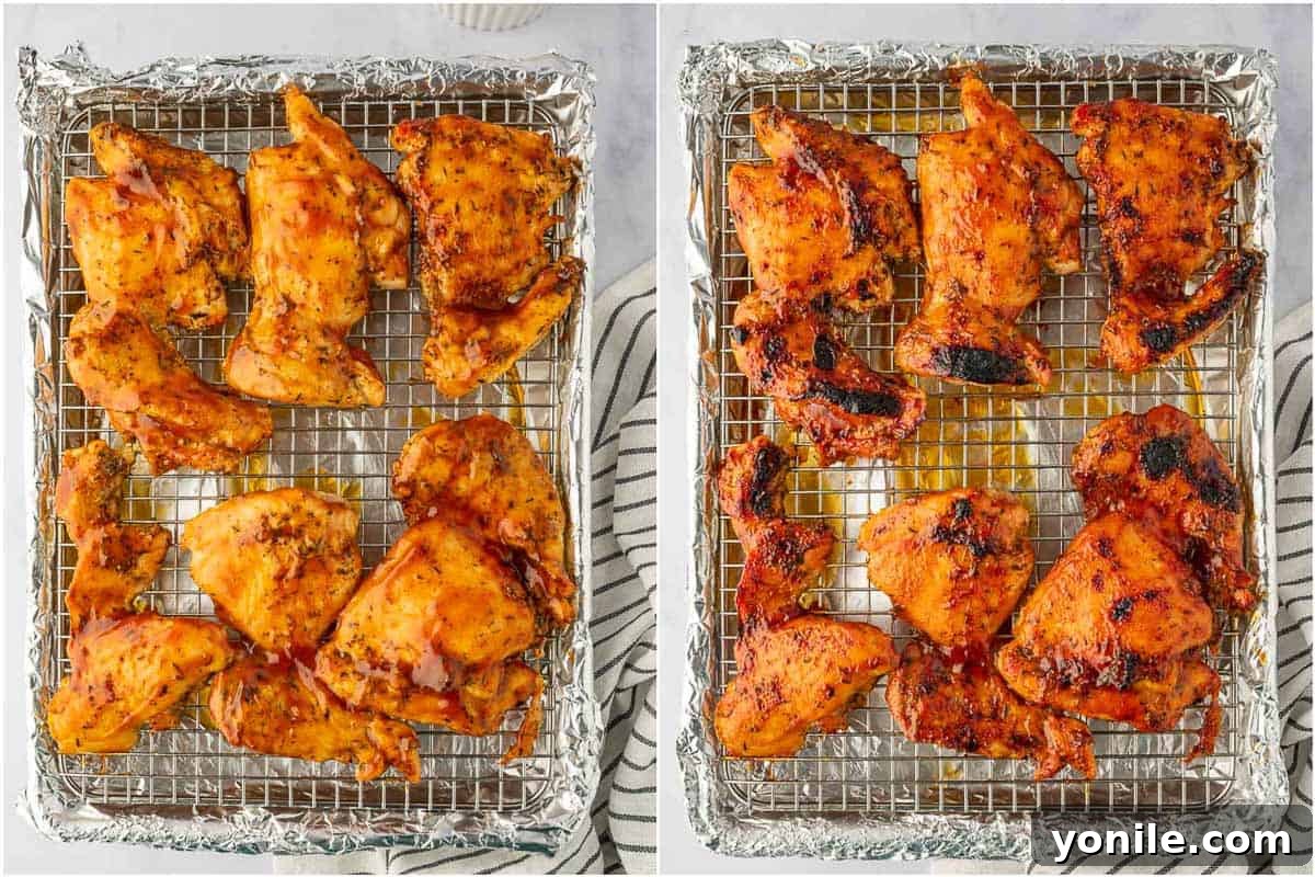 Close-up of perfectly baked and broiled BBQ chicken thighs, glistening with sauce and showing slight charring, fresh out of the oven.