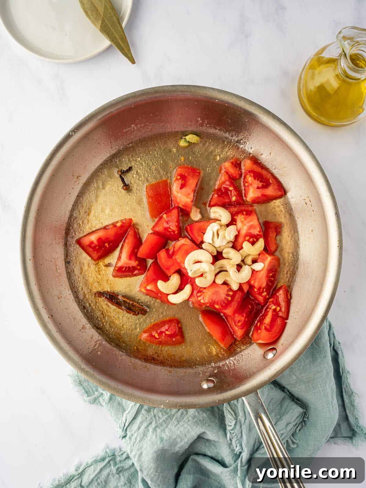 Royal Paneer Pasanda 6 Tomatoes and cashews simmering with whole spices to create the base for the gravy.
