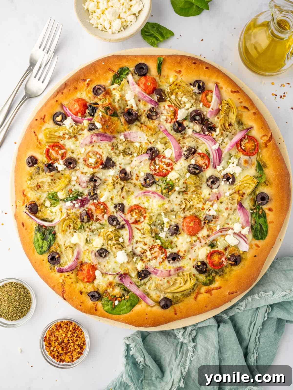 Homemade Mediterranean Pizza Feast 10 A perfectly baked homemade Greek pizza recipe, showcasing its inviting golden crust and abundant Mediterranean toppings.