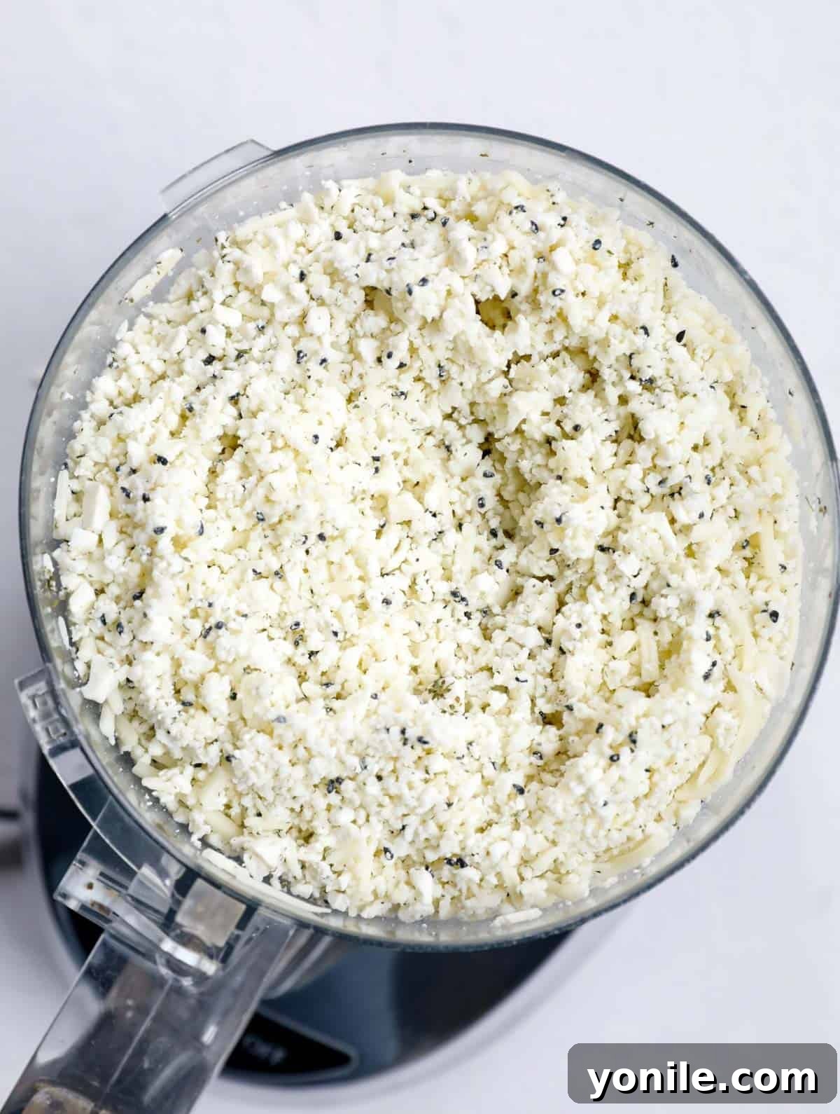 Crispy Cheese Rolls 4 A vibrant bowl showcasing the rich and aromatic cheese stuffing, expertly mixed with dried mint and nigella seeds, ready for the Lebanese cheese rolls.