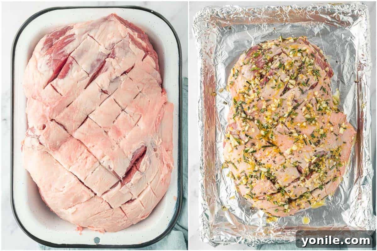 A boneless leg of lamb, expertly scored and richly coated with a vibrant aromatic marinade, poised on a baking sheet before roasting.