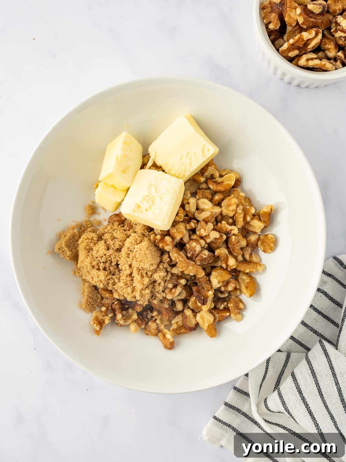 Mixing the maple walnut topping for sweet potatoes.