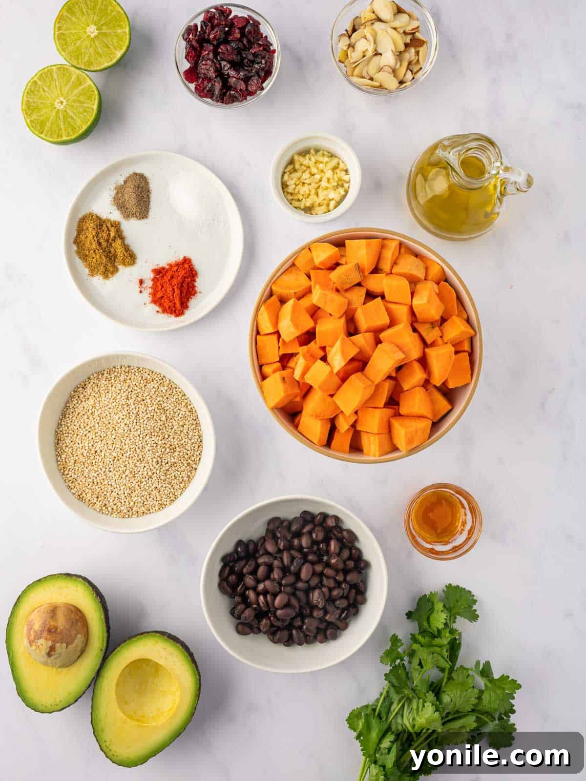 A collection of fresh ingredients neatly laid out, ready for preparing roasted sweet potato quinoa salad.