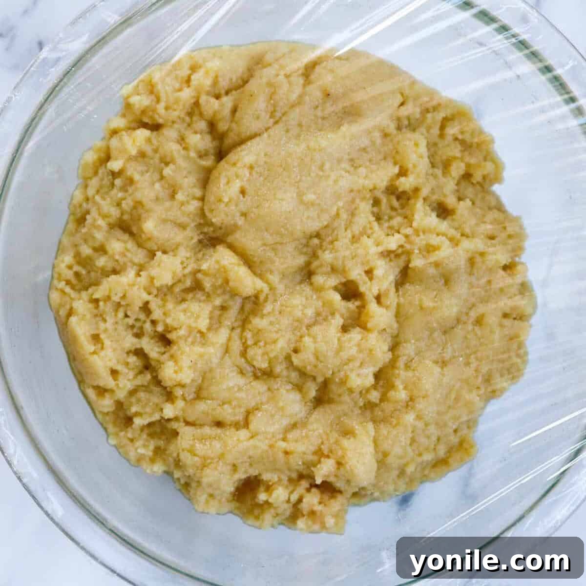 Maamoul Irresistible Date Cookies 7 Maamoul dough in a bowl, showing a soft and pliable consistency before its final rest.