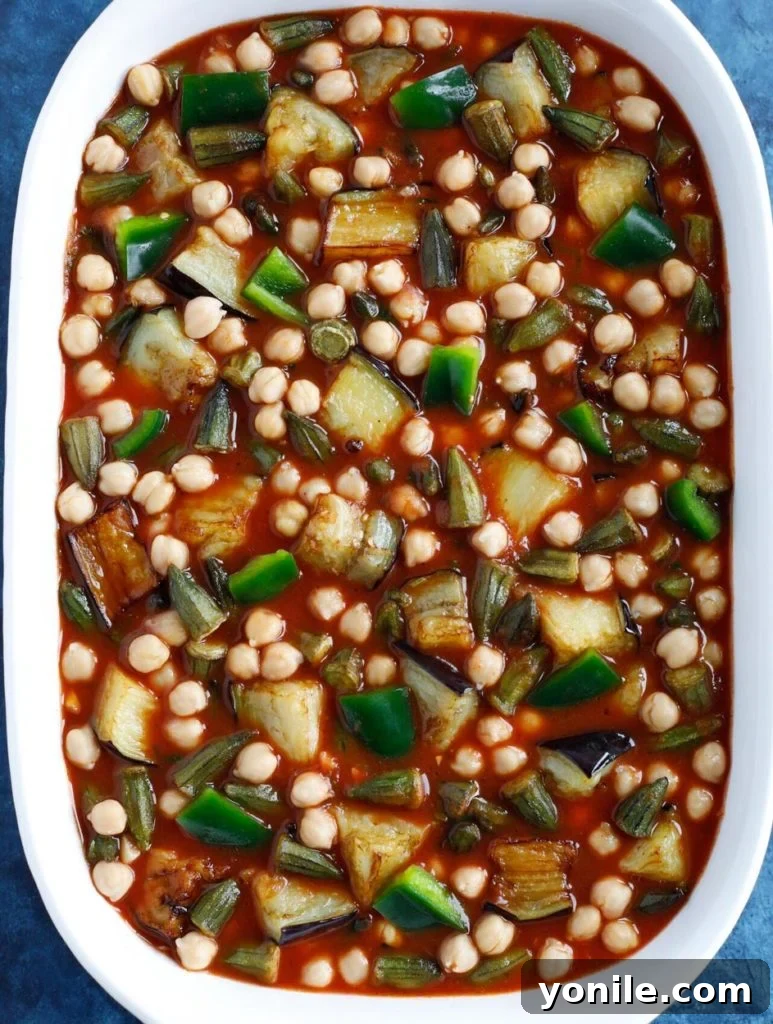 Maghmour in a white baking dish before being baked in the oven