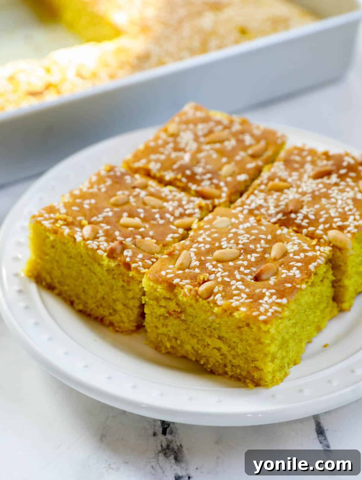 Pieces of Lebanese Turmeric Cake (sfouf) on a plate.