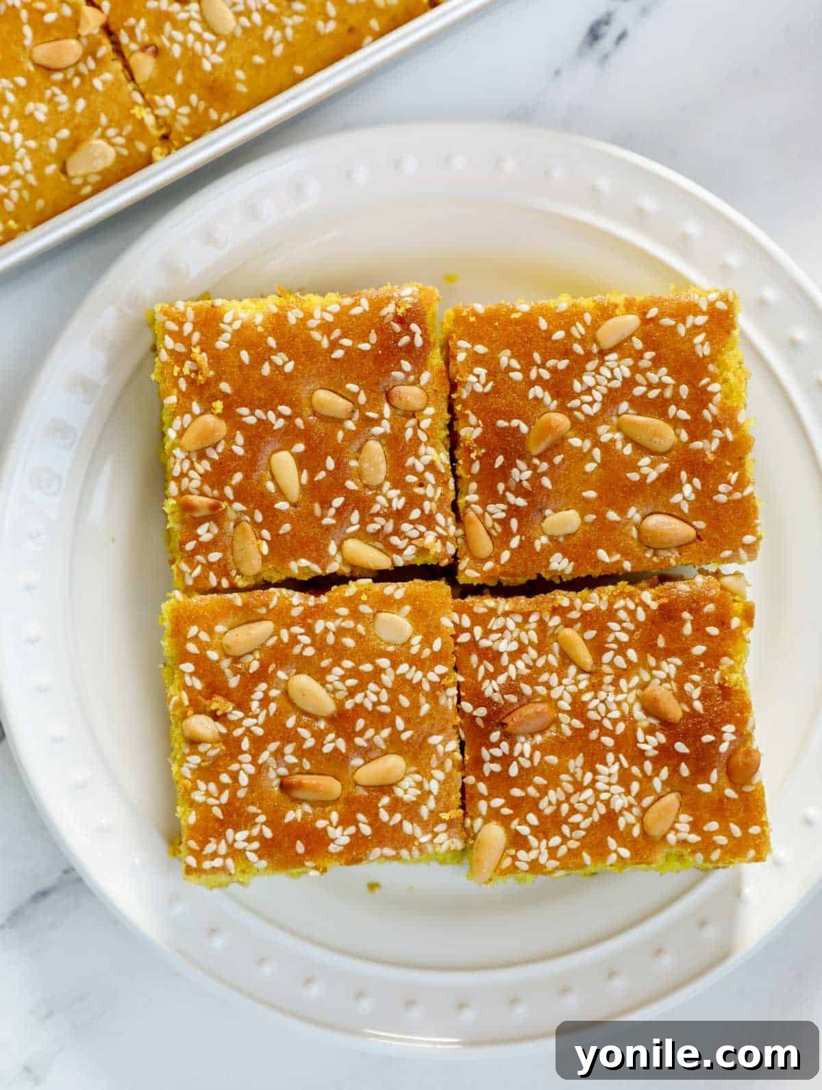 Pieces of Lebanese Turmeric Cake (sfouf) on a plate.