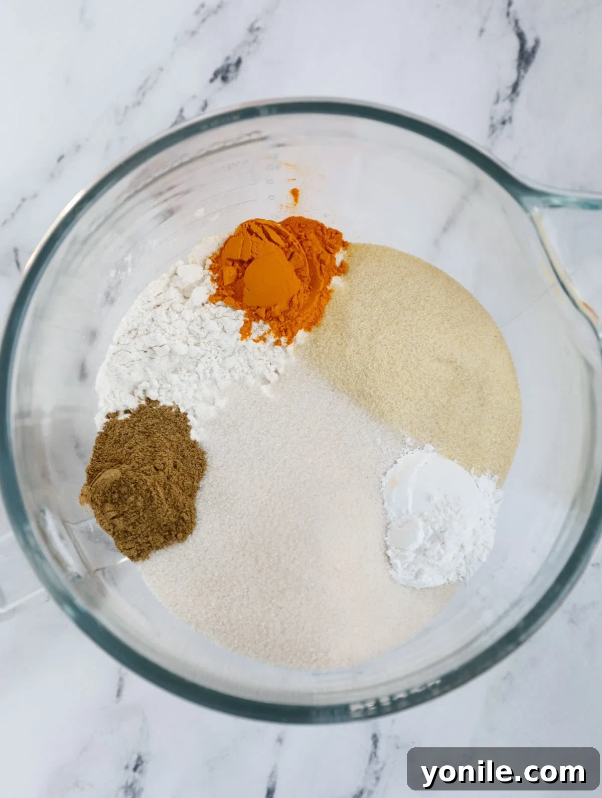 Dry ingredients of sfouf cake in a bowl.