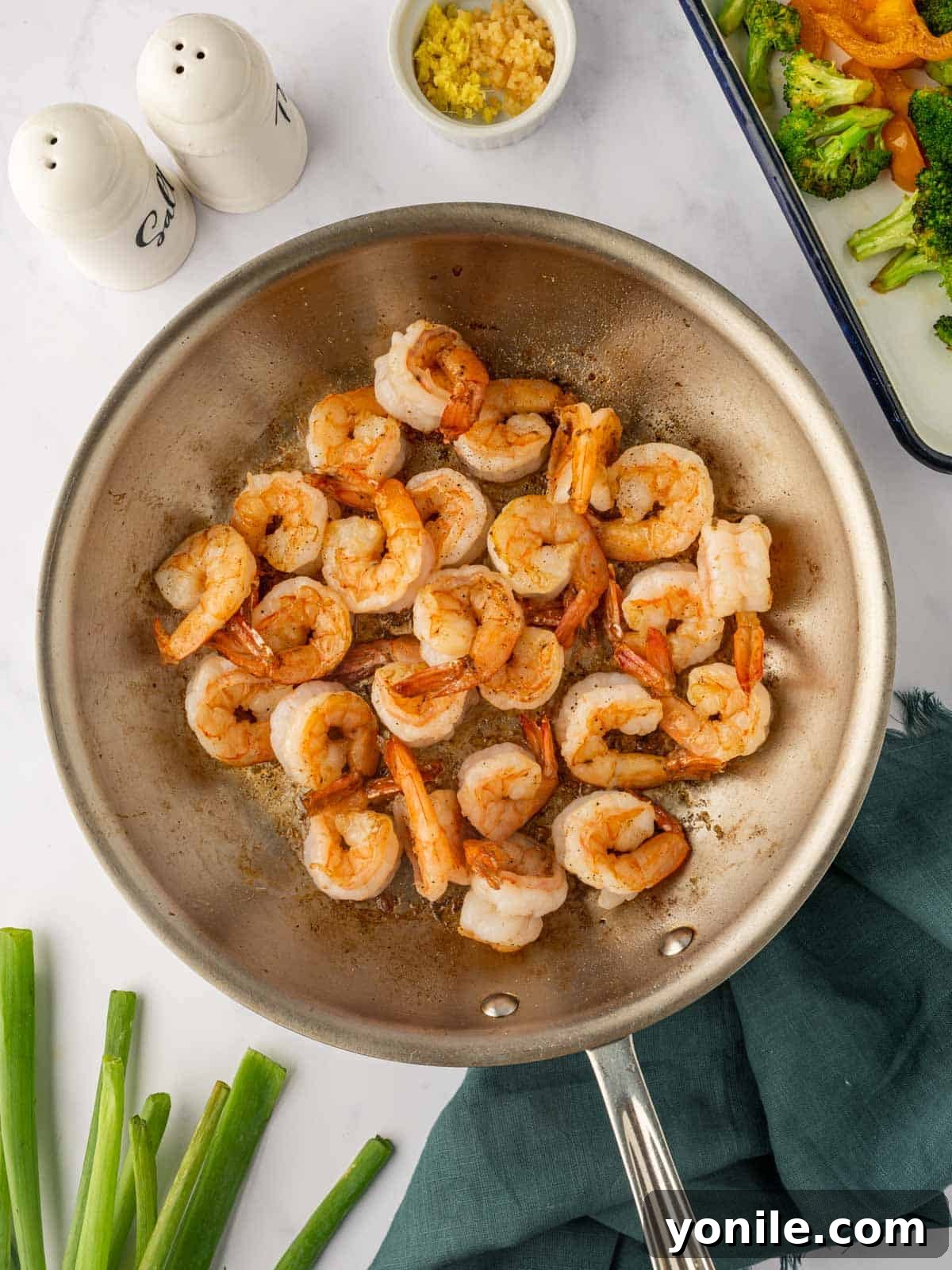 Sticky Sweet Chili Glazed Shrimp 4 Shrimp being sautéed in a hot skillet until perfectly pink and opaque.