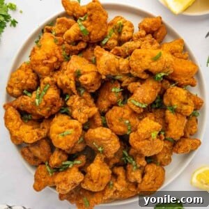 A large serving platter of chicken pakora.