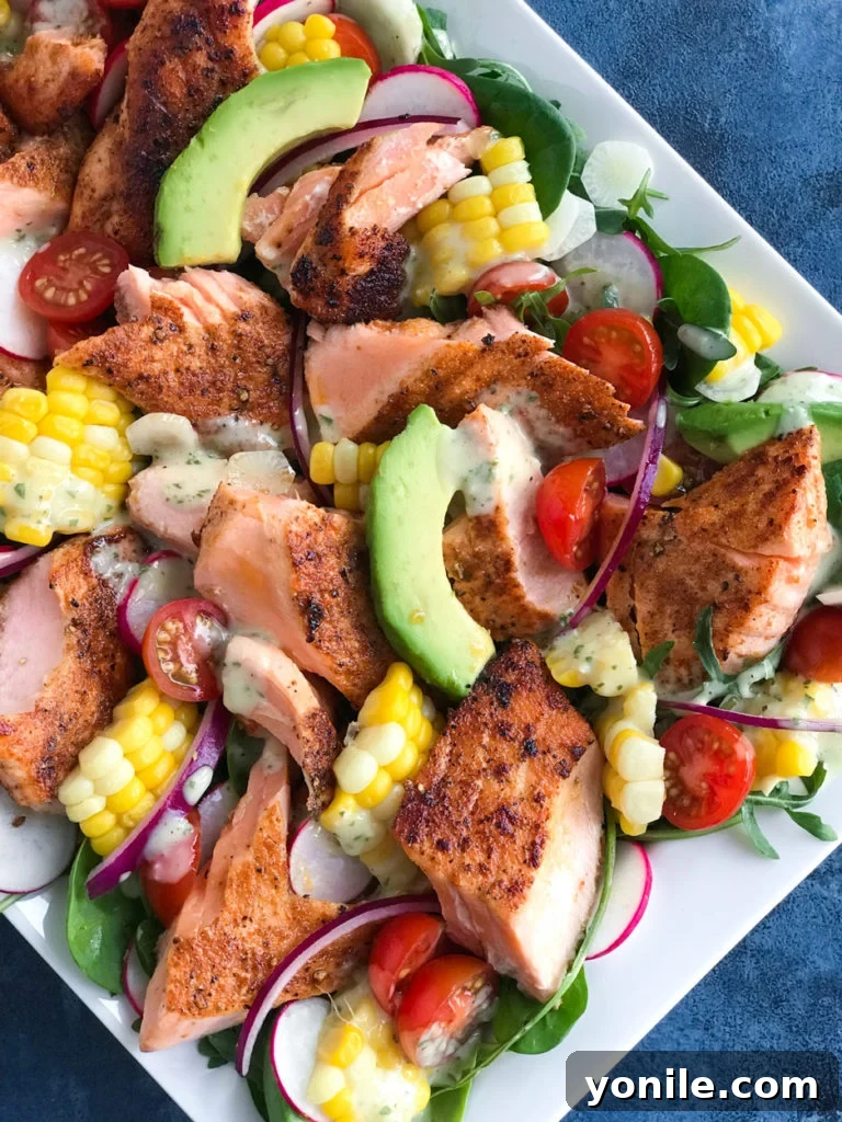 A vibrant and appetizing close-up of the finished spicy salmon salad dish.