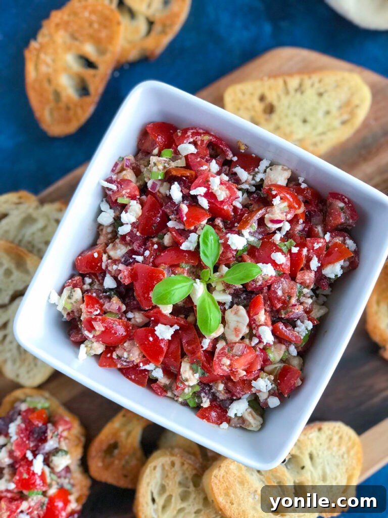 Feta Bruschetta: The Perfect Party Appetizer Feta Bruschetta, a delightful gourmet appetizer with a unique twist.