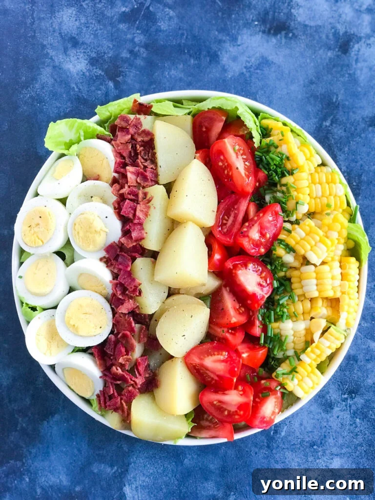 Potato Cobb Salad in a bowl without dressing