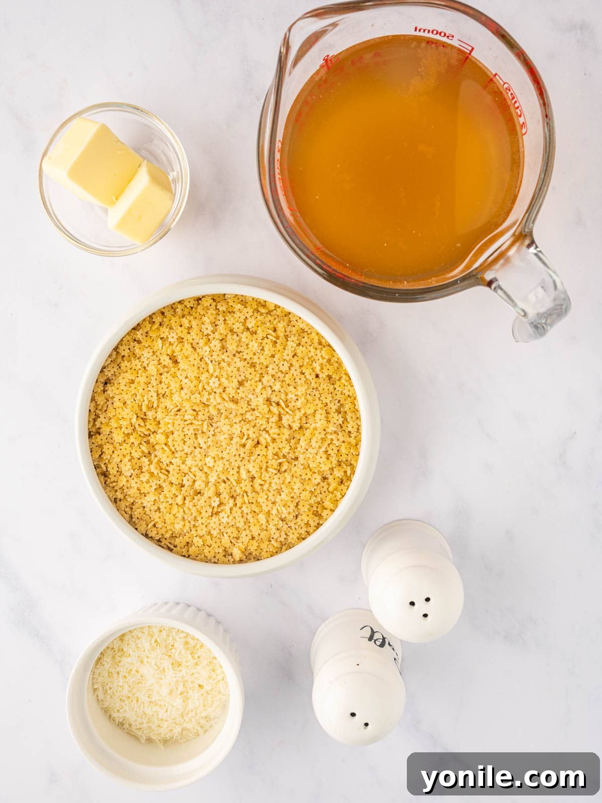 Italian Pastina Comfort 3 Various ingredients like chicken broth, stelline pasta, butter, and parmesan cheese for pastina pasta.