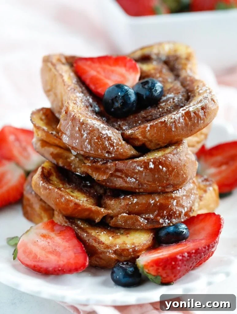 Stack of Cinnamon Swirl French Toast with fresh berries