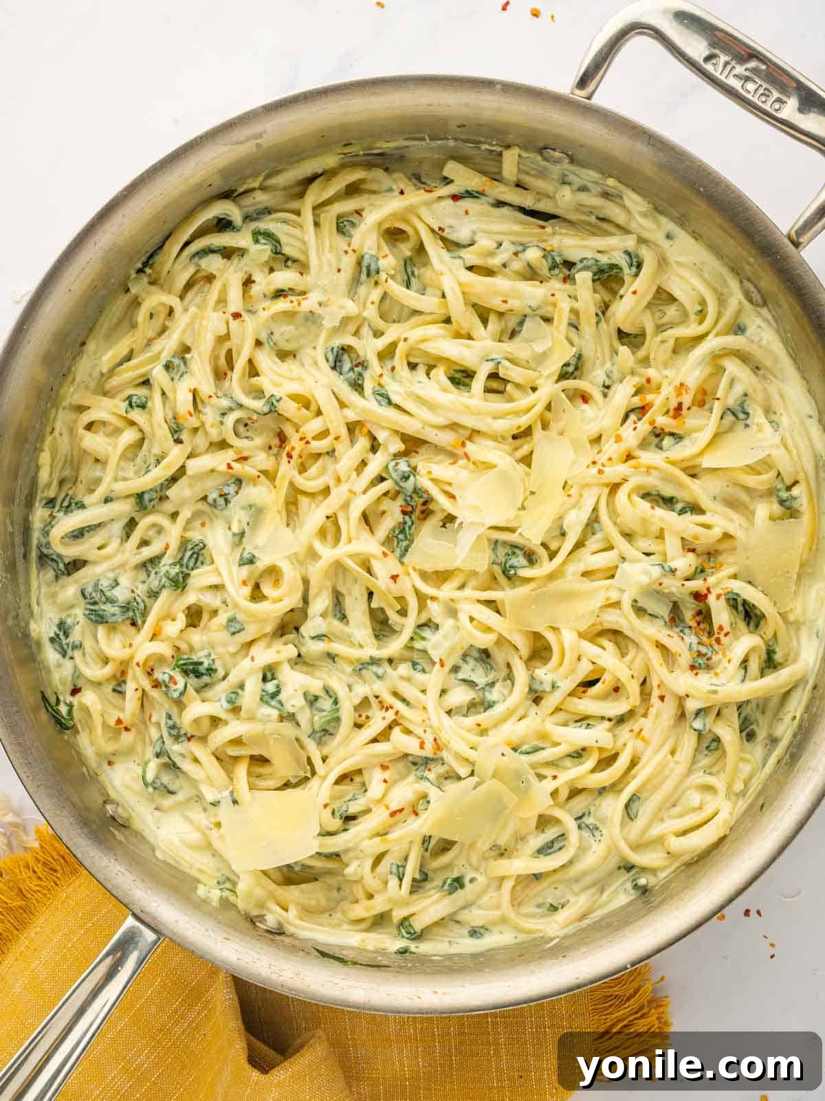Cheesy pasta in a skillet.