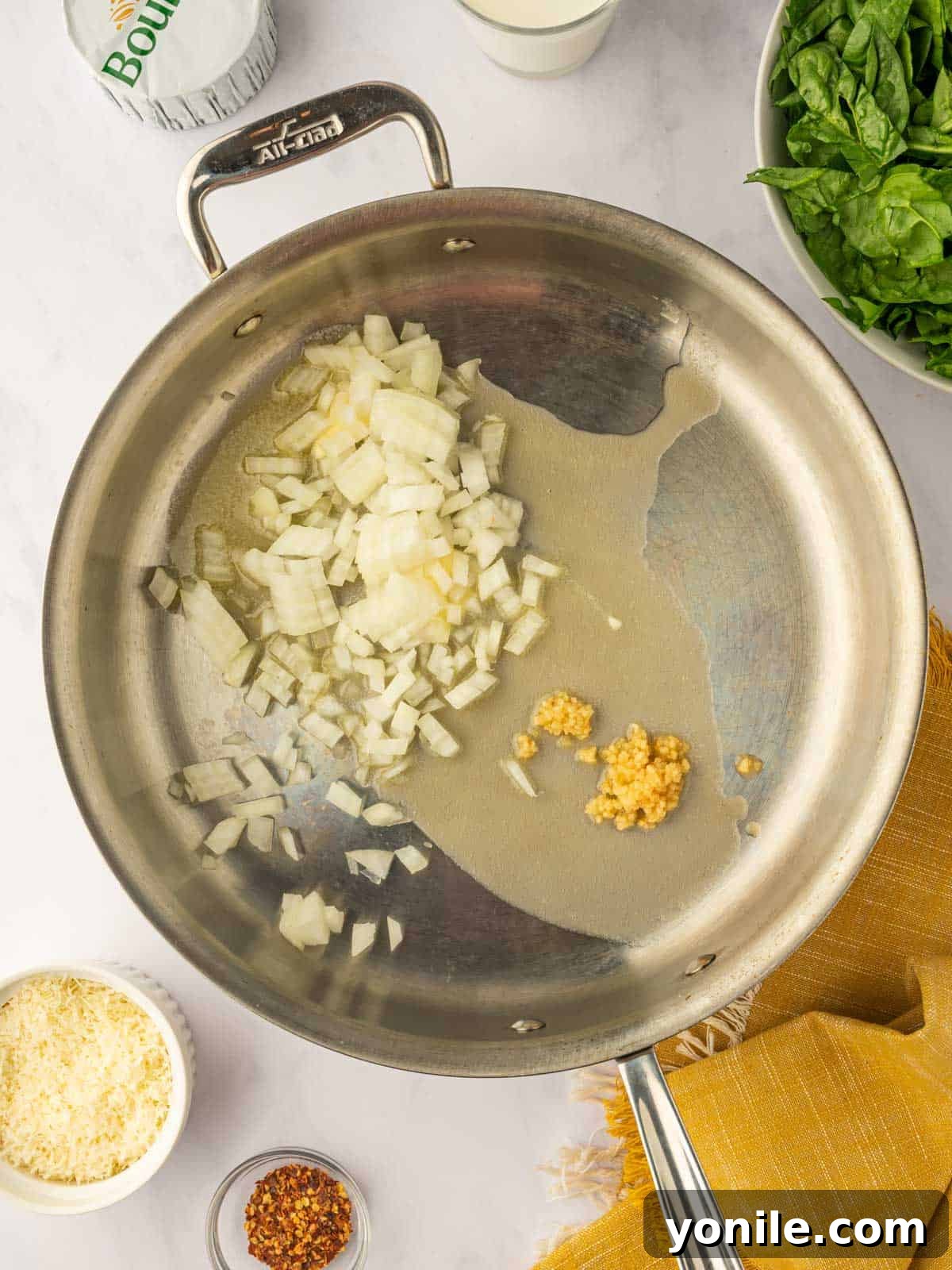 Saute onions and garlic in a skillet.