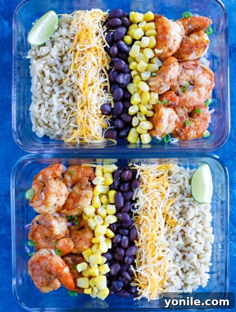 Delicious Shrimp Taco Meal Prep Shrimp Taco Meal Prep bowls neatly arranged in glass containers, showcasing a colorful mix of ingredients like seasoned shrimp, black beans, corn, and rice.
