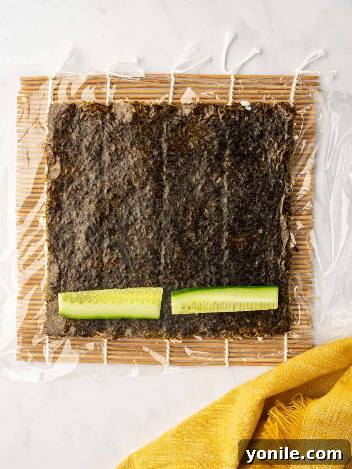 Dynamite Salmon Roll 11 Fresh cucumber strips are layered neatly onto the nori sheet with rice.