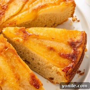 Slices of upside down pear cake on a plate.