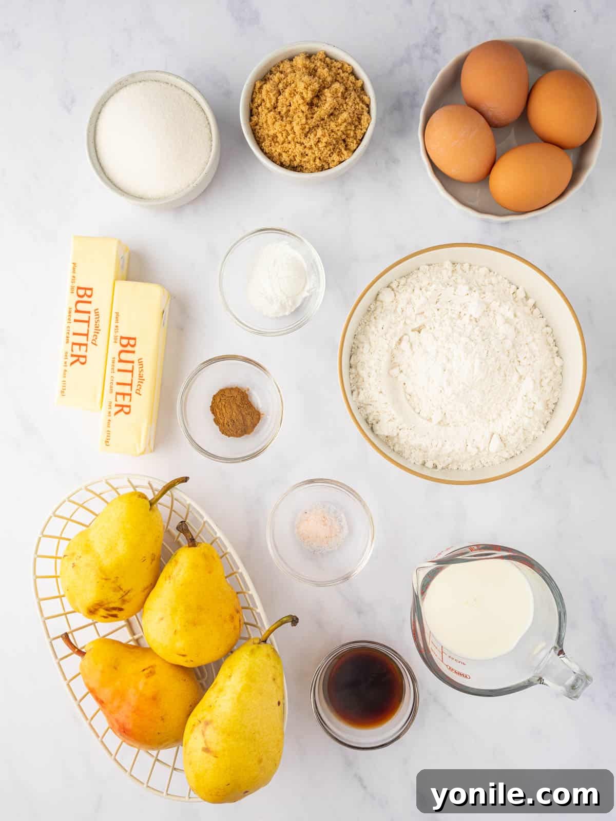 Ingredients for upside down pear cake laid out on a kitchen counter.