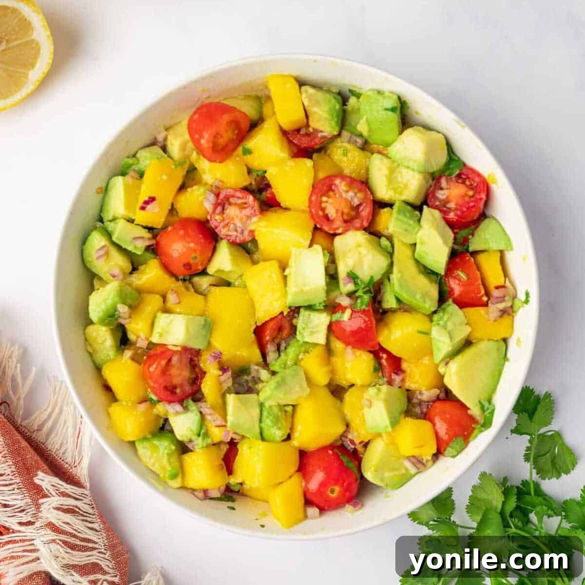 Avocado mango salad in the process of making.