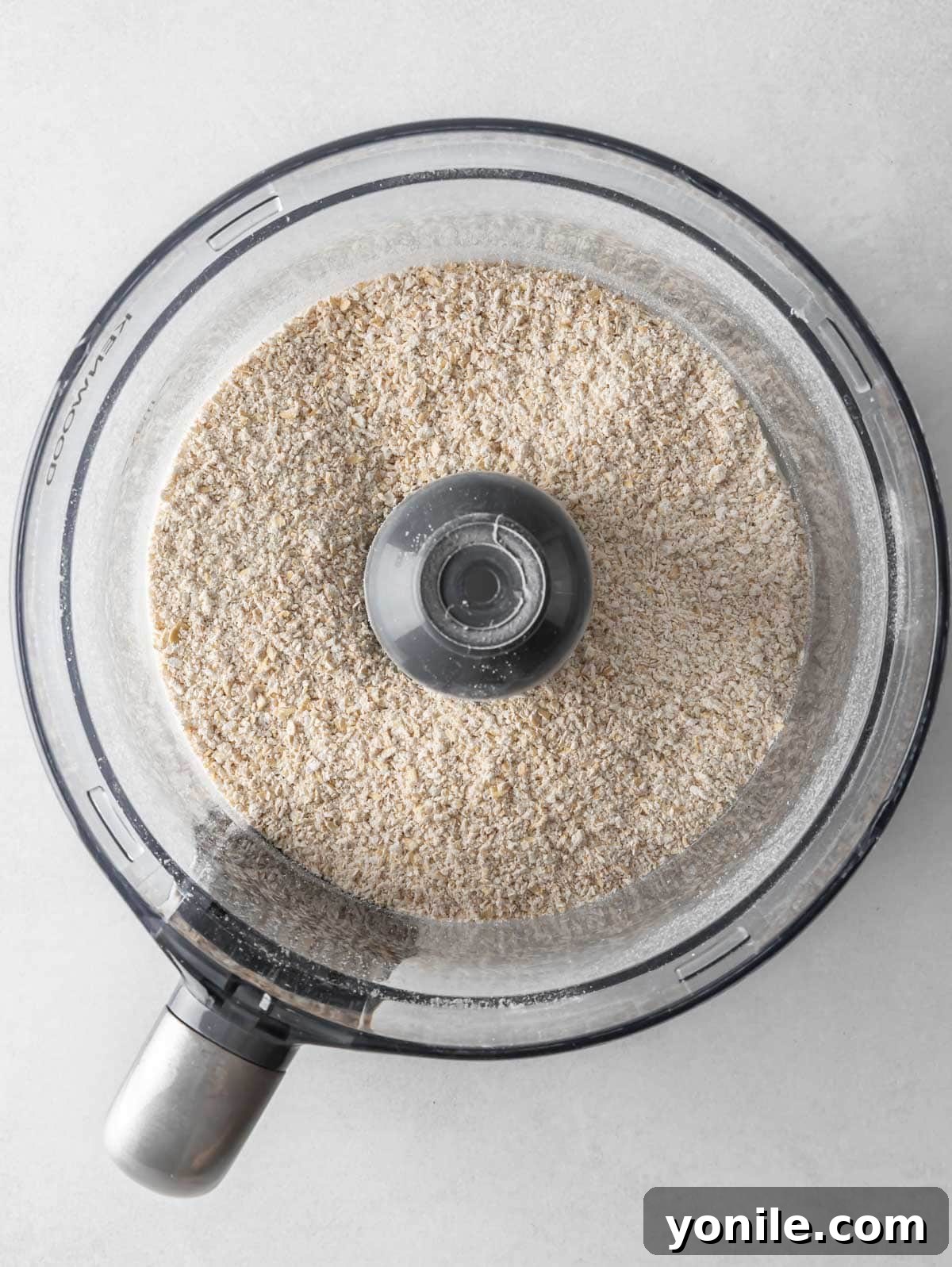 Pancake batter mixing in a food processor, showing a smooth, consistent texture.